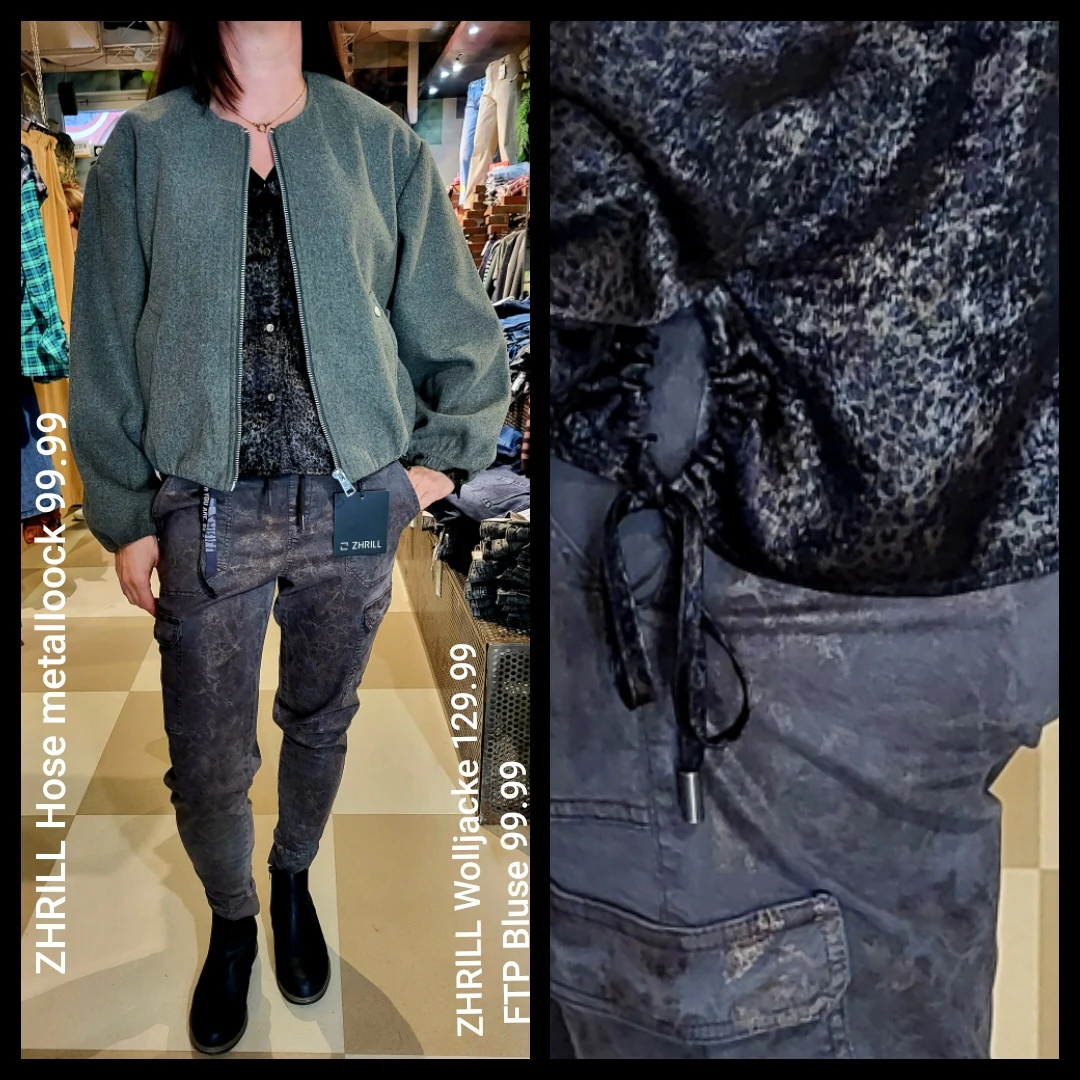 Grüne Jacke mit gemusterter Bluse und dunkler Hose im Crash Store.
